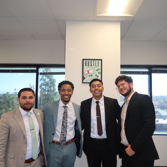 Two Capital Vision Enterprise team members at the office