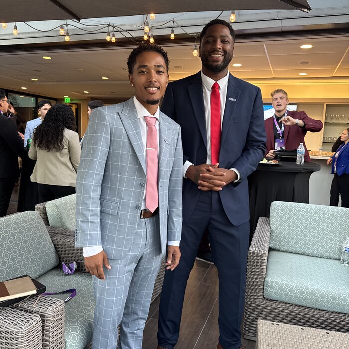 Two Capital Vision Enterprise team members at an event
